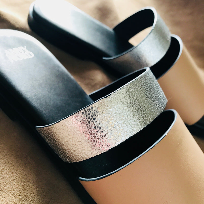 BUSY DOING NOTHING is a comfortable luxury slide sandal in pale nude and silver leather from Swedish shoe and accessory brand ANNY NORD