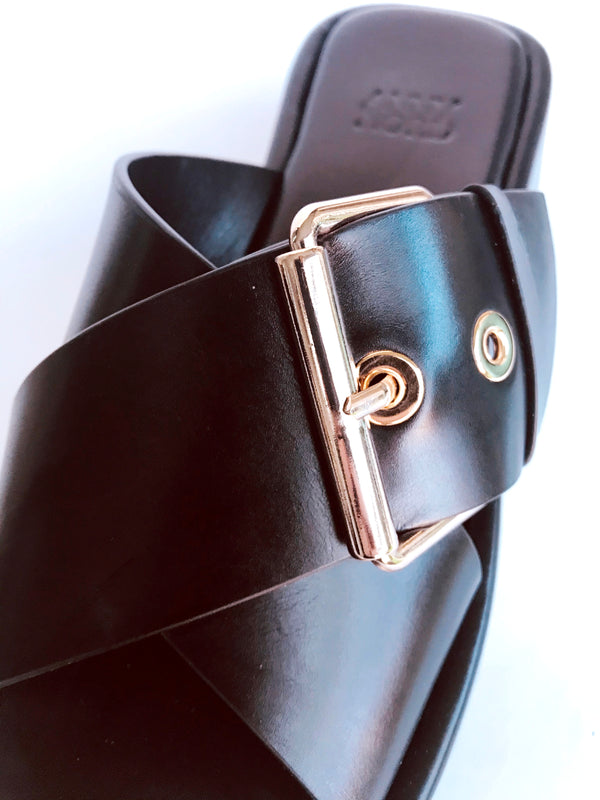 Gold buckle detail on chunky sandals from Swedish shoe brand ANNY NORD.