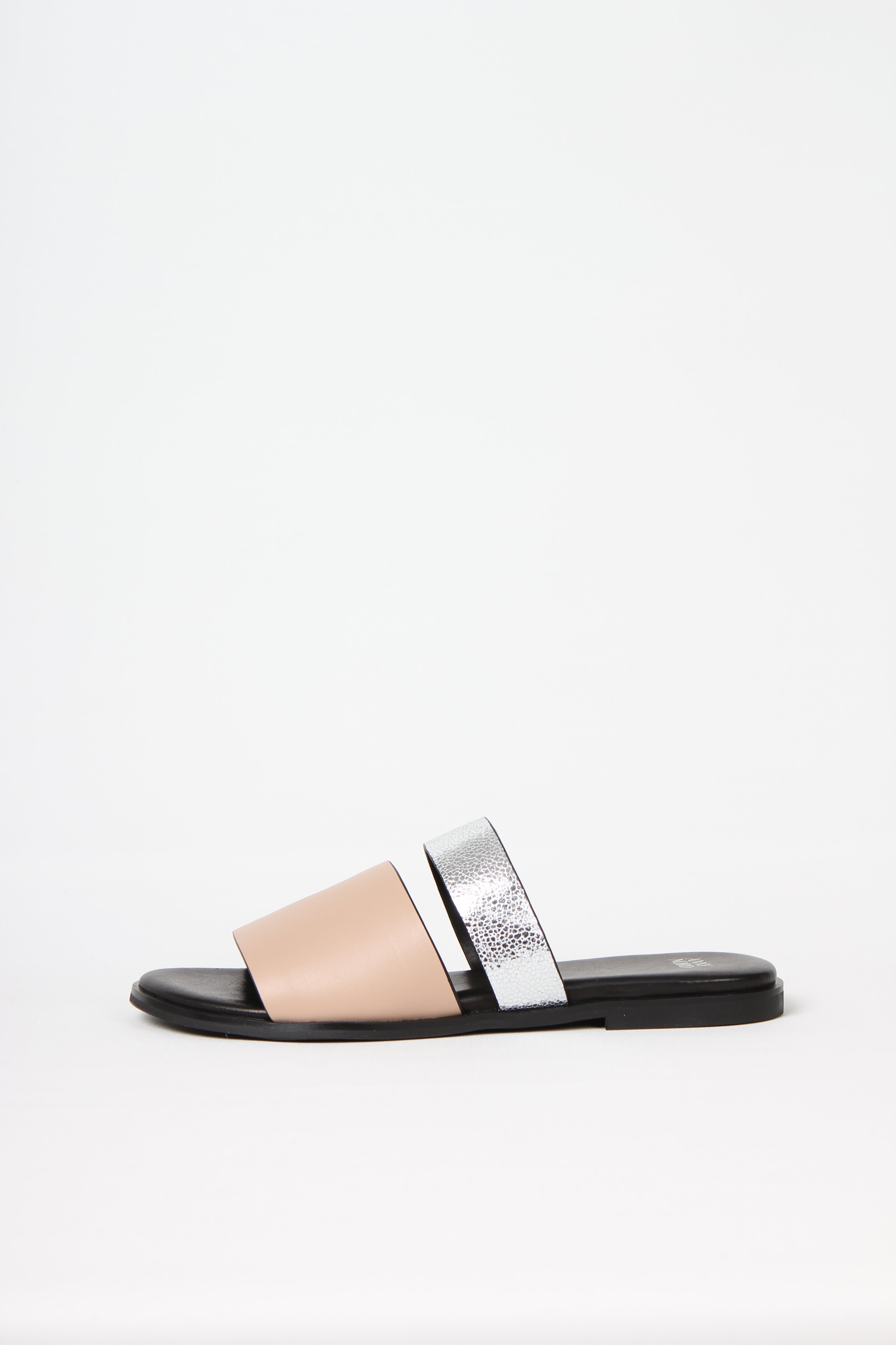 BUSY DOING NOTHING is a comfortable luxury slide sandal in pale nude and silver leather from Swedish shoe and accessory brand ANNY NORD