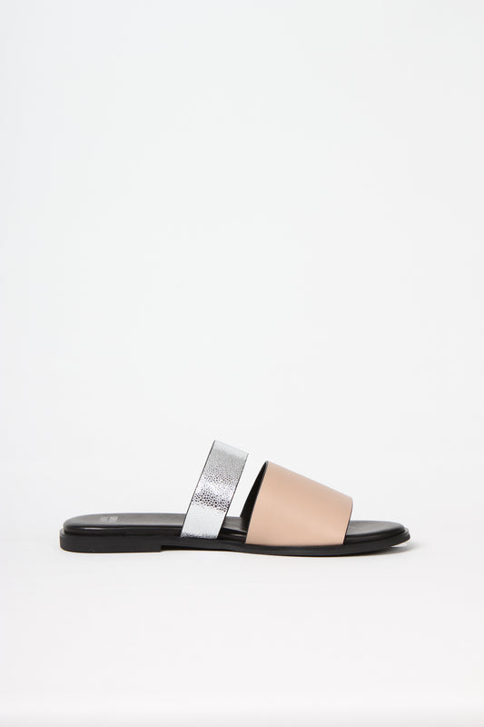 BUSY DOING NOTHING is a comfortable luxury slide sandal in pale nude and silver leather from Swedish shoe and accessory brand ANNY NORD