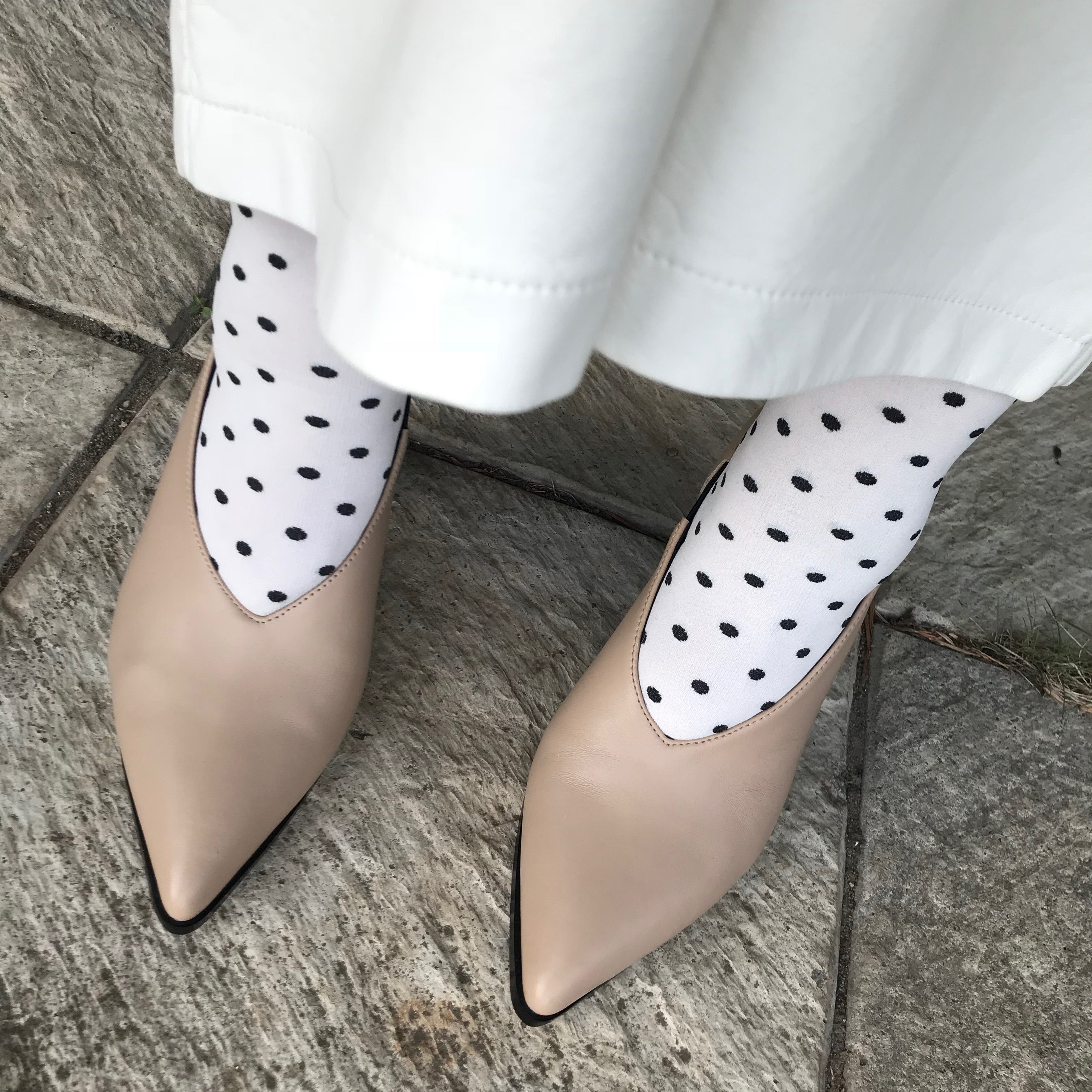 Roach Killer V-cut pump from Swedish shoe brand ANNY NORD.  A classic shoe with a modern twist. Here styled with polka dotted socks and leather skirt.