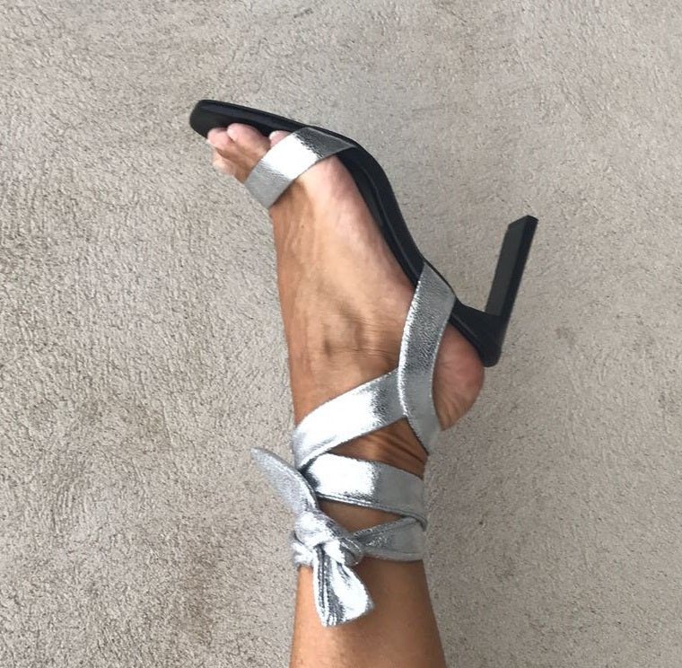 Wrap tie, party sandal in super soft silver metallic leather from Swedish shoe brand ANNY NORD. Heel height 80 mm.
